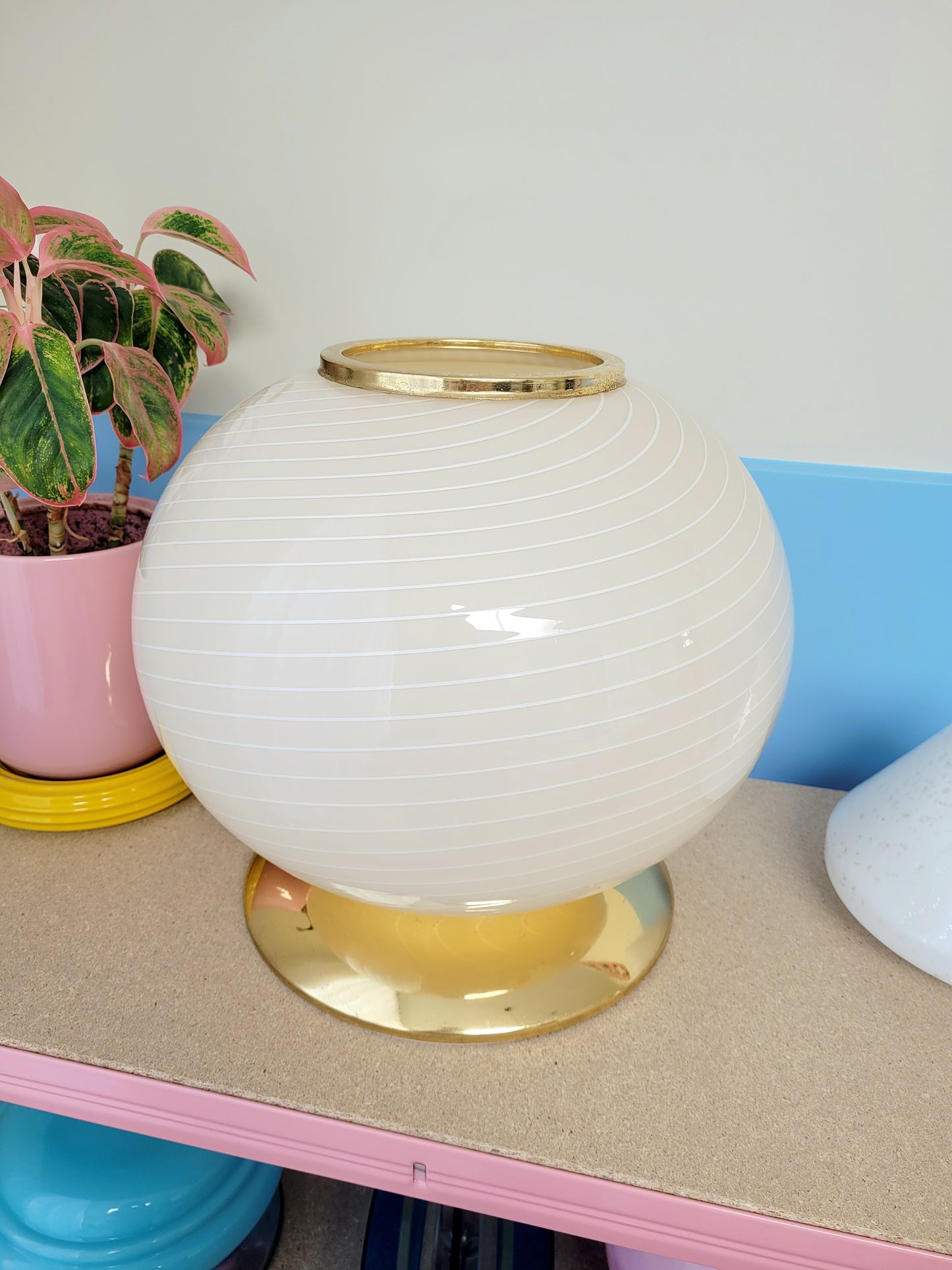 vintage Murano table lamp in a soft light yellow or cream hue with swirl pattern and a brass base