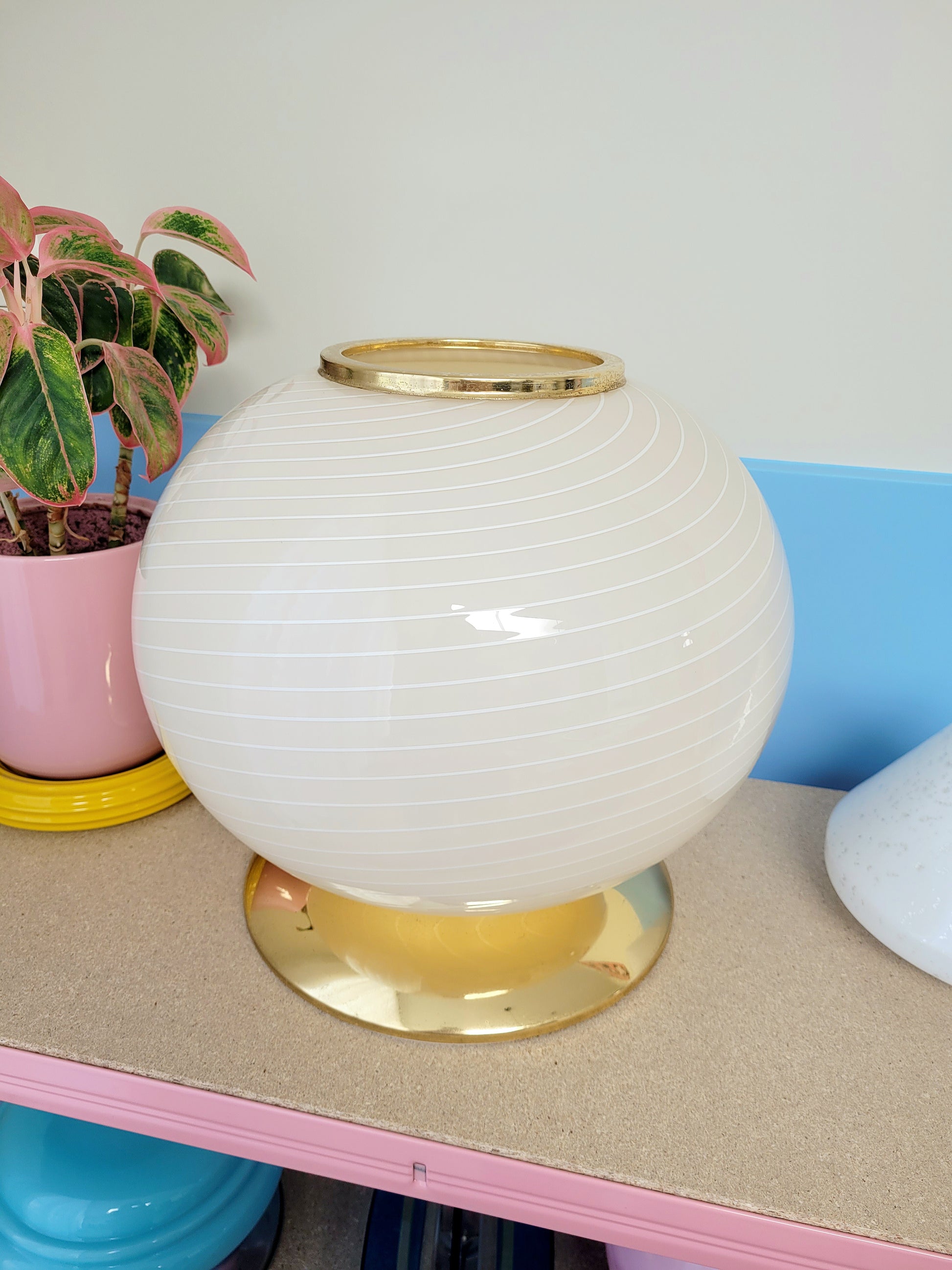 vintage Murano table lamp in a soft light yellow or cream hue with swirl pattern and a brass base