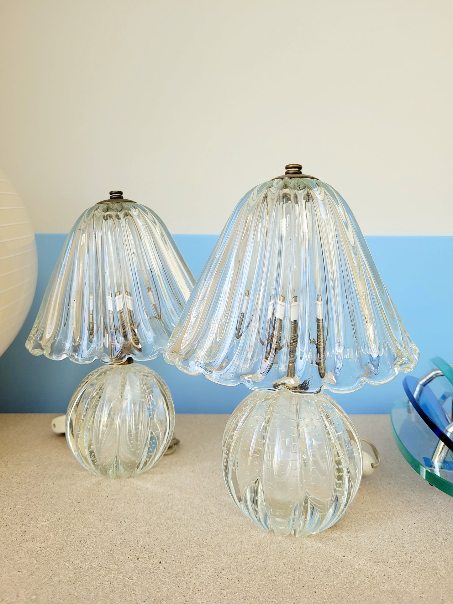 front view of a pair of vintage clear Murano table lamps