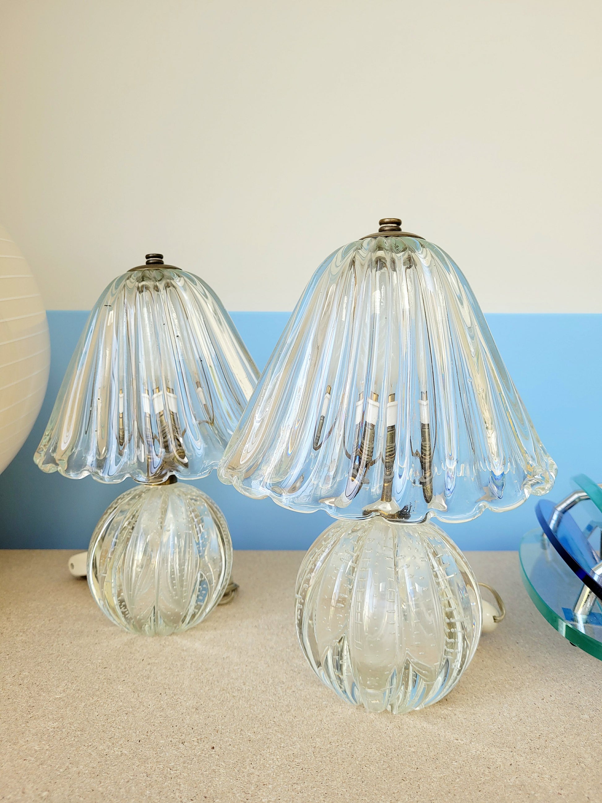 front view of a pair of vintage clear Murano table lamps