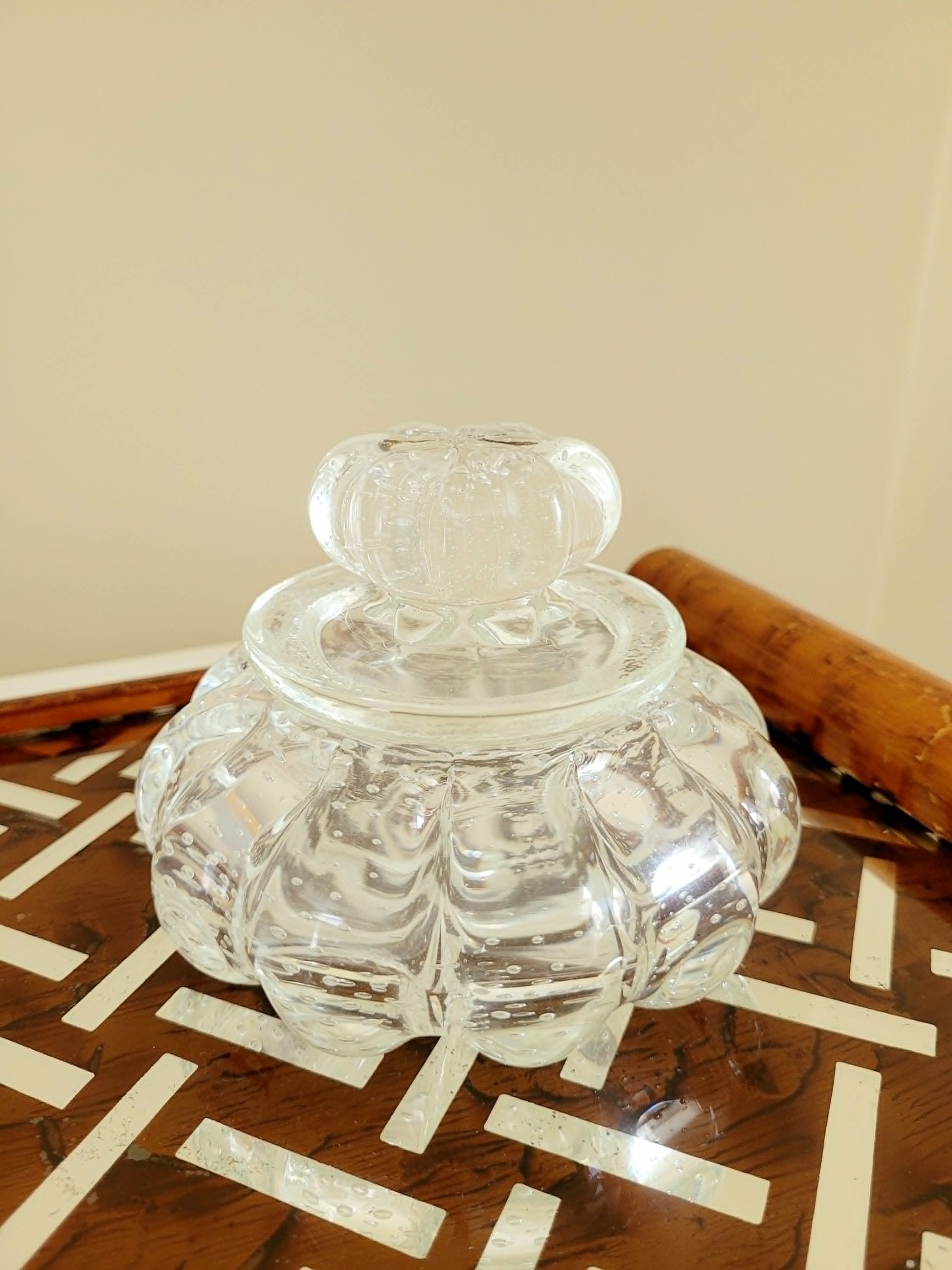 front view of a vintage clear bonbonniere jar in Murano glass with bullicante design