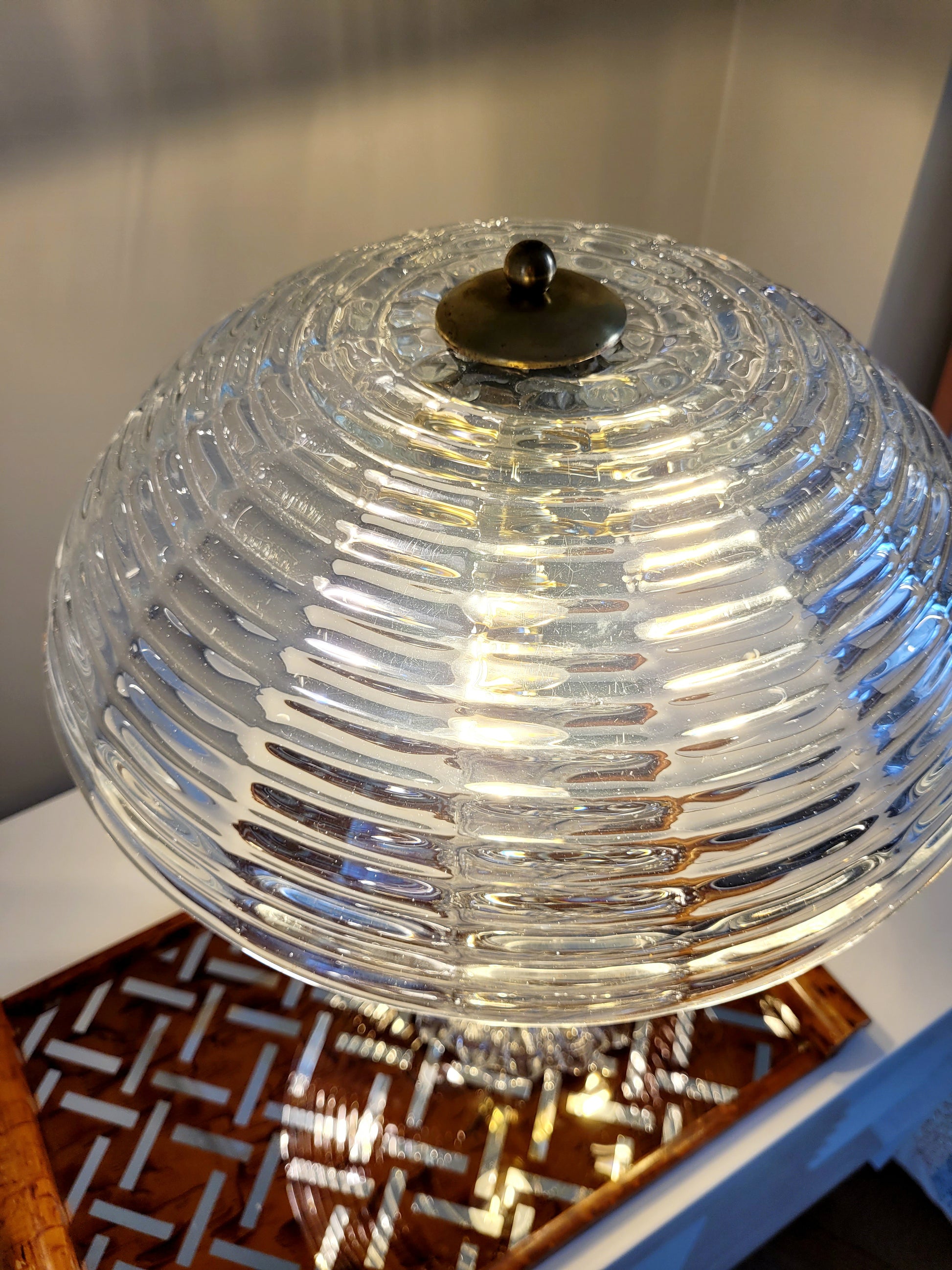 clear Murano glass table lamp feauturing a ribbed shade and brass hardware