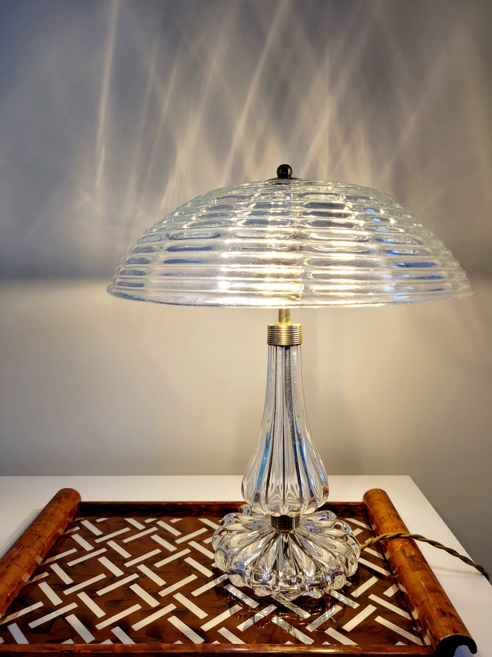 clear Murano glass table lamp feauturing a ribbed shade and brass hardware