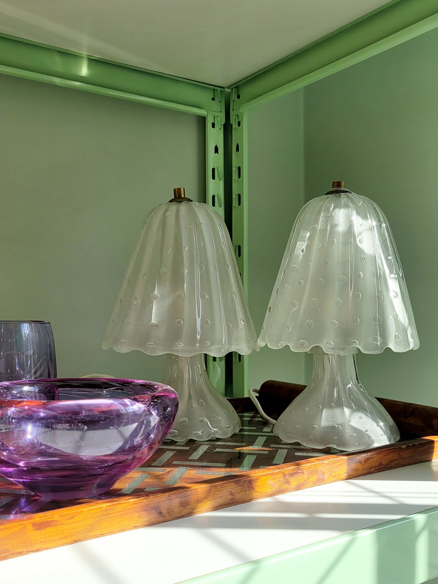 side view of a pair of vintage frosted Murano table lamps