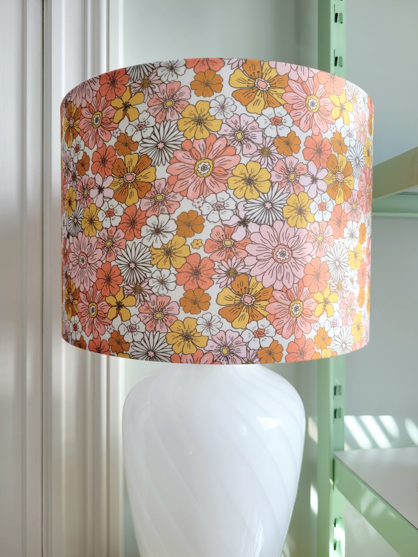 detail of a vintage Murano table lamp with white swirl and lovely floral lamp shade
